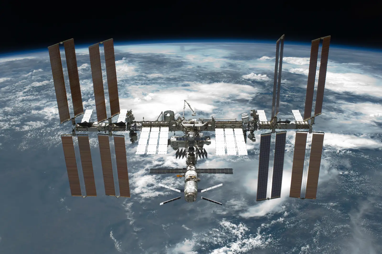 The International Space Station over Earth, photographed after the STS-134 mission, May 2011.